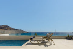 This captivating holiday home blends perfectly into its natural surroundings. It Greece Pearl Villa III, redefined island chic! Entire villa vacation rental 51556004