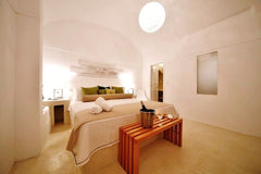 Featuring open-plan styled bedroom with a double bed, bathroom with shower and a  Superior Double Caldera View Room in hotel vacation rental 32685222
