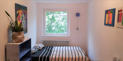 A cozy bedroom looking to a peaceful courtyard minimally decorated with a double Vienna, Austria A cozy bedroom in a central but quiet neighborhood Private room in rental unit vacation rental 35080924