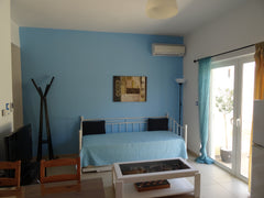 It is a two room house, consisted of a living room with 2 iron beds, a well equi  Giannmary Blue House Entire rental unit vacation rental 14617892