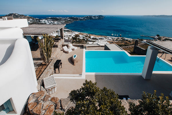Traditional Cycladic architecture, with soothing colors of white, infused by the Fort Lauderdale, FL Diana Villa Mykonos-The Luxury 