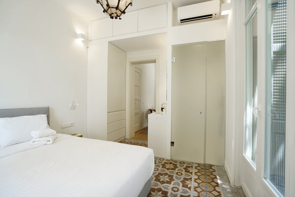 A fully renovated old Athenian building in to a modern classic apartments with a Athens, Greece Plues Suites Athens / E Entire rental unit vacation rental 50837651