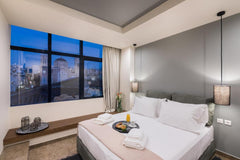 Our luxurious suites have a spacious and comfortable open-plan bedroom, with Que GR Deluxe Double Room City view Room in aparthotel vacation rental 43447120