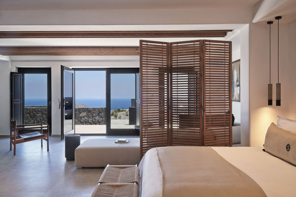 Deluxe Suite features 1 king-size double bed and 2 single sofa-beds and can host  Deluxe Suite - SantAnna Luxury Suites Imerovigli Room in boutique hotel vacation rental 42087584