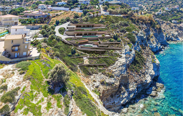 This luxurious villa is built on a rock at the edge of a cliff overlooking the C Croatia Awesome home in Gazi, Heraklio with 3 Bedrooms Entire home vacation rental 50469484