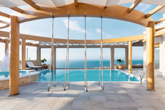 Luxury Villa sits high atop a hill overlooking AgiaPelagia Bay, where earth and  Rethimnon, Greece Minimalist Mediterranean Estate with Sea View Infinity Pool Entire villa vacation rental 12573470