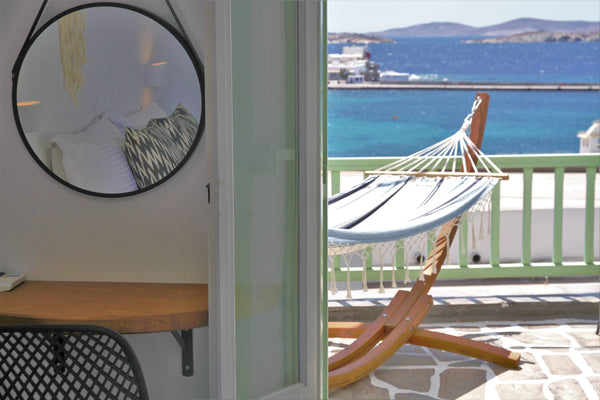 The room consist of a double-bed , or two single beds upon request, a refrigerat London, United Kingdom Yalos Mykonos town private rooms Sea & Sunset view Private room in home vacation rental 47810096