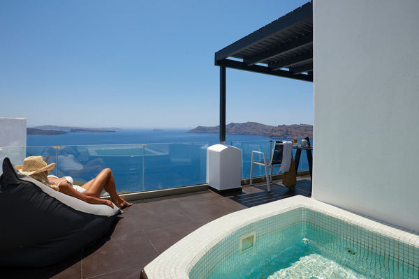 Features built-in, outdoor, large hydromassage tub with direct caldera and sea v  Exclusive Suite with Outdoor Heated Private Jacuzzi Room in hotel vacation rental 39737526