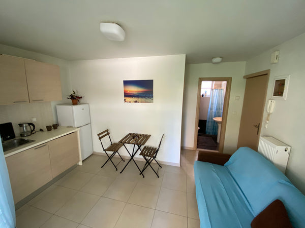 Cosy apartment with a bright bedroom full of color. Living room with sofa and fu  Orion Apartment Entire rental unit vacation rental 44511801