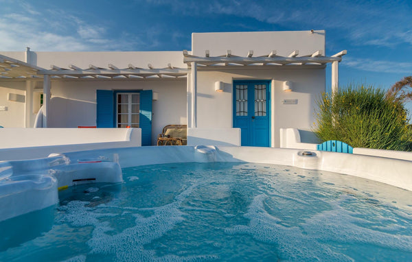 Vibrant colours against white washed backgrounds make this 50 sq.m luxury suite  Greece Cycladic Sea View Suite with hot tub Room in boutique hotel vacation rental 6195256