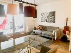 The apartment has an open plan living room kitchen with a counter, couch and arm Vienna, Austria Stylish apartment between Karlsplatz & Schönbrunn Entire rental unit vacation rental 35982782