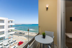 Our Modern Sunny Studio is located right on the beach road of Rethymno. <br />On Rethimnon, Greece Renovated Sunny Sea View Studio|Balcony & Elevator Room in serviced apartment vacation rental 21704287