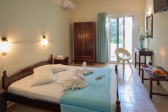 just 20 meters from the beach in the center  of Plakias we are waiting for you a  CORALI STUDIOS PLAKIAS Room in boutique hotel vacation rental 30545602