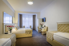 Very nice family room in  hotel Taurus<br /><br /><b>The space</b><br />Hotel Ta  Standard Quadruple room in hotel TAURUS Room in boutique hotel vacation rental 28169174