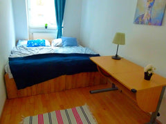 You have a private bedroom with a queen-size double bed, a wardrobe, and a writi Vienna, Austria Double room with terrace access - 15 min to center Private room in condo vacation rental 49317243