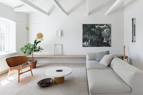 Curl up on the slouchy, neutral couch with a soothing cup of tea at a zen post-a Copenhagen, Denmark Soak in the Sleek, Freestanding Tub at a Chic Former Stables Entire home vacation rental 33160867