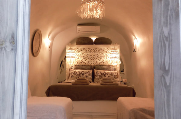 The cave house located in Finikia is surrounded by terraced vineyards. This is o  Casa Selini Bohemian Cave Private room in cycladic house vacation rental 50500950