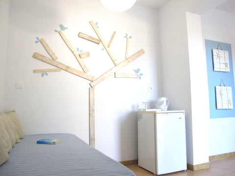 At 700 meters from the port and 100 meters from the beautiful beach of Livadia,  Paros, Greece Angelina Studios triple room Entire rental unit vacation rental 18650307