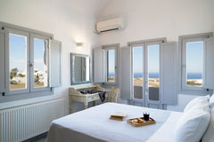Modern style house located near the center of the island, Fira. The bedroom with  Thetis | Modern Apartment | Private Parking Area Cycladic home vacation rental 25448147