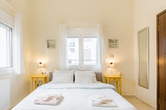 Kick back on the comfortable outdoor furniture on the terrace looking out across Chania, Greece Litsa's Elegant Apartment, a few minutes walk to the Old Town Entire rental unit vacation rental 13970398