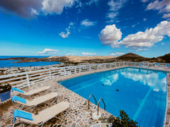 Golden Sunset Paros is a complex of hotel rooms and apartments located on a hill  Superior Family Apartment - Golden Sunset Paros Entire serviced apartment vacation rental 31921851
