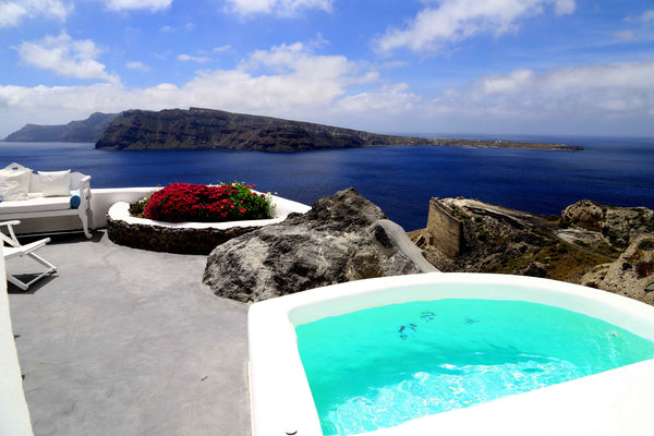 Combining traditional and modern architecture this cave-style room offers unique Greece Private Cave House with hot tub and Sunset View Room in boutique hotel vacation rental 32107126