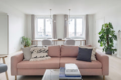 Pluck a book from the open shelving and take it easy on the blush-pink sofa at a Assenede, Belgium Overlook the City's Rooftops at a Bright, Bohemian Haven Entire rental unit vacation rental 24512050