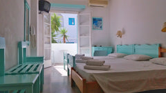 Cozy Room close to the beach, located in a quiet area. The building is following  Kymata Hotel C - Cozy B&B Triple Room in Kamari. Private room in bed and breakfast vacation rental 18845789