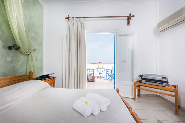 Our room is located in a quiet neighborhood, yet only a few minutes walk from Fi Greece Private single room with a view in Karterados Room in bed and breakfast vacation rental 24196905
