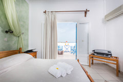 Our room is located in a quiet neighborhood, yet only a few minutes walk from Fi Greece Private single room with a view in Karterados Room in bed and breakfast vacation rental 24196905