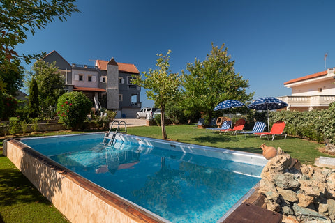 At Villa Kalaitsidis, time moves at a different pace: in elegant and comfortable  Luxury Villa with private pool, sauna, gym and... Entire villa vacation rental 586232864090219429