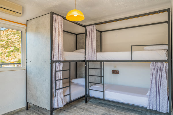 Our cheapest option! Like all of our dorms, it is spacious and bright, and equip  Bed in 8 bed dorm in Matala Hostel Shared room in hostel vacation rental 514251563798871542