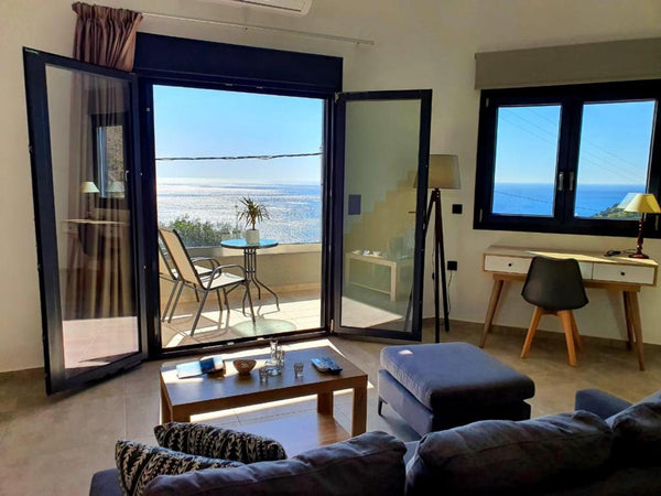 The combination of the discreet landscaping and the lighting design of the “Cret London, United Kingdom Nereos - Crete Southside Villas Entire home vacation rental 588099294620173269