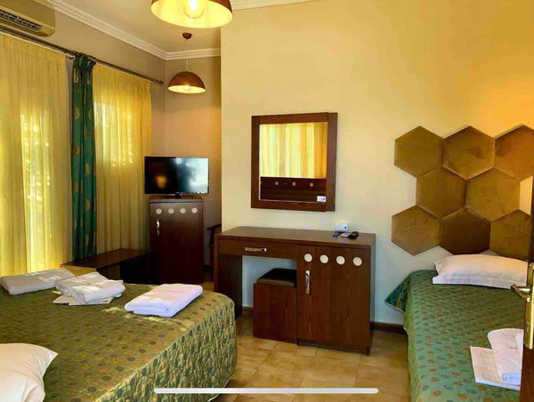 Hotel Semiramis is a hospitable, family-run hotel in a quiet neighborhood of Ada Adamantas, Greece Semiramis Guesthouse  Triple Room Central & Cozy Private room in bed and breakfast vacation rental 21898107