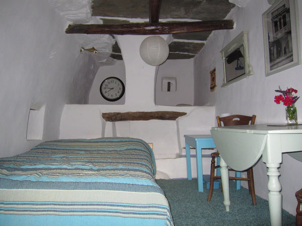 An unusually beautiful room, once a grape press area and part of an old farm hou  The Magic Room: a converted grape press in Arni. Private room vacation rental 12349528