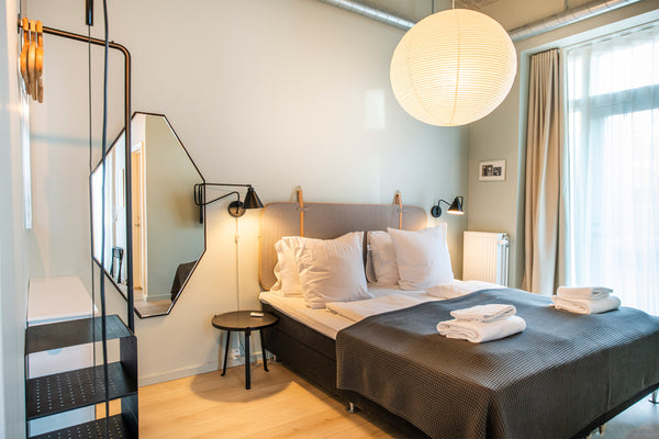 This bright and beautiful studio apartment is bathed in daylight from floor-to-c Copenhagen, Denmark By The Beach Apartments D - IntoThisPlace Room in serviced apartment vacation rental 26117463