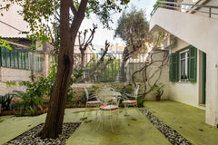 Dine on the leafy patio and soak up the last of the evening sun at this pastel-h Athens, Attica, Greece Get Retro Vibes at a Quirky Vintage Apartment in the Sky Entire rental unit vacation rental 22144862