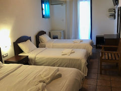 All rooms are sea view with balcony and offer air conditioning, 43" flat TV and  Loutro, Greece Quad with Partial Sea View Room in hotel vacation rental 9273462