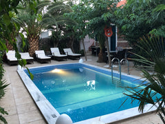 DANAE VILLA  IS A SMALL DELIGHTFUL FAMILY RUNNING BED AND BREAKFAST HOTEL IN SAN Fira, Greece danae villa Private room in bed and breakfast vacation rental 8121870