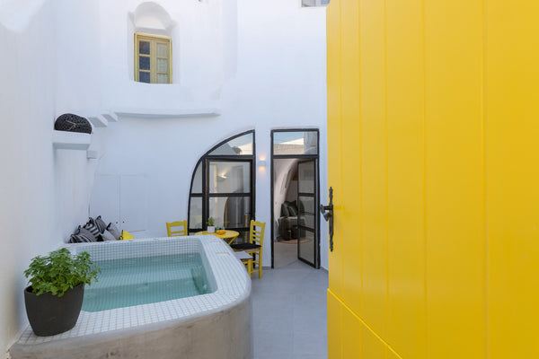 Casa Grande is a happy place. A cheerful canary yellow greets you at the door, u  Casa Grande cave house with Jacuzzi Cycladic home vacation rental 49890067