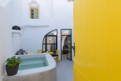 Casa Grande is a happy place. A cheerful canary yellow greets you at the door, u  Casa Grande cave house with Jacuzzi Cycladic home vacation rental 49890067