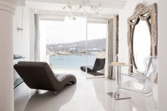 Masterfully built along a rocky slope, KIVOTOS dazzles with the spectacular arch  Kivotos Mykonos Junior Suite with Sea View Room in hotel vacation rental 43150115