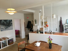 The appartement is top floor with lot of light and an open view. The decor is a  Copenhagen, Denmark Bright top-floor flat in lovely multicultural area Entire rental unit vacation rental 24131081