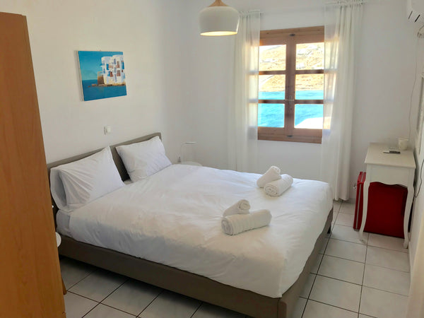 The 20sqmeters room is a part of a building complex nesting in the hill overlook Mikonos, Greece Cozy Sea-View Room Entire rental unit vacation rental 35615209