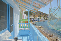 The wires(sirma) are small, white houses with bright colored wooden doors in nat Greece house on the beach klima Cycladic home vacation rental 4947425