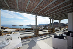 A large 80 sq m luxury apartment with a lovely private garden equipped with chai Míkonos, Greece Luxury apartment Harmony, lounge area, sea view Entire serviced apartment vacation rental 21736152