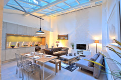 Beautiful 61 sqm apartment, only lit by a glass dome, on the ground floor withou Paris, France Show Room, 2BR/2BA, 6 people Entire rental unit vacation rental 9500785