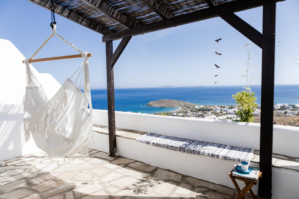 Perched above the bay of Porto Agios Ioannis, this cheerful apartment set amongs Tinos, Greece Bella Vista 1BR Sunny Terrace Sea Views, Hammock, Shared Pool Entire rental unit vacation rental 50281664