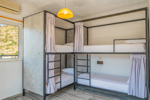 A private four bed room with en-suite bathroom in Matala Hostel, Europe's southe  Four Bed Room with bathroom in Matala Hostel Private room in hostel vacation rental 514259355661515221