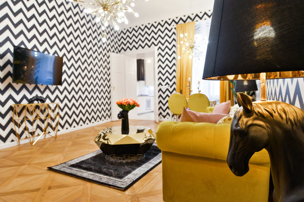 Relax on the yellow velvet sofa between the two horses, who form a beautiful lig Prague, Czechia Dalí Wenceslas Square Apartment Entire serviced apartment vacation rental 32867194
